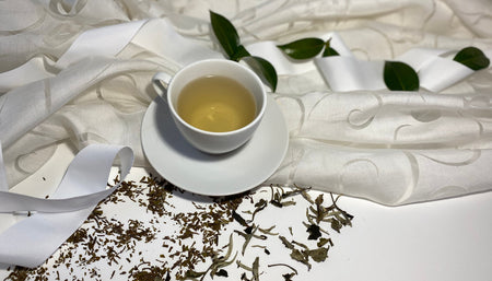 White loose leaf tea in a cup